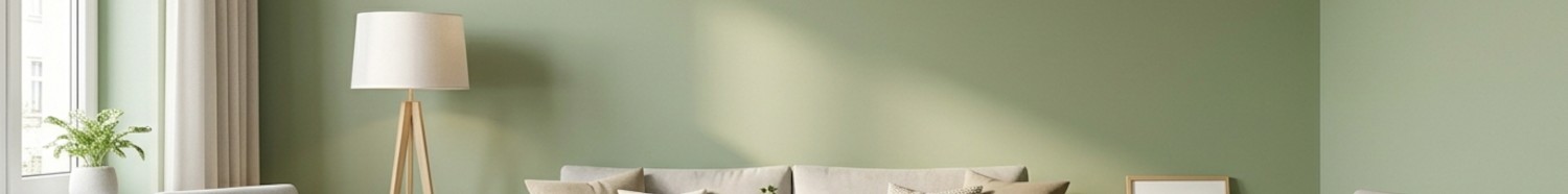 Modern gestaltetes Wohnzimmer mit sauber gestrichenen Wänden in Salbeigrün.